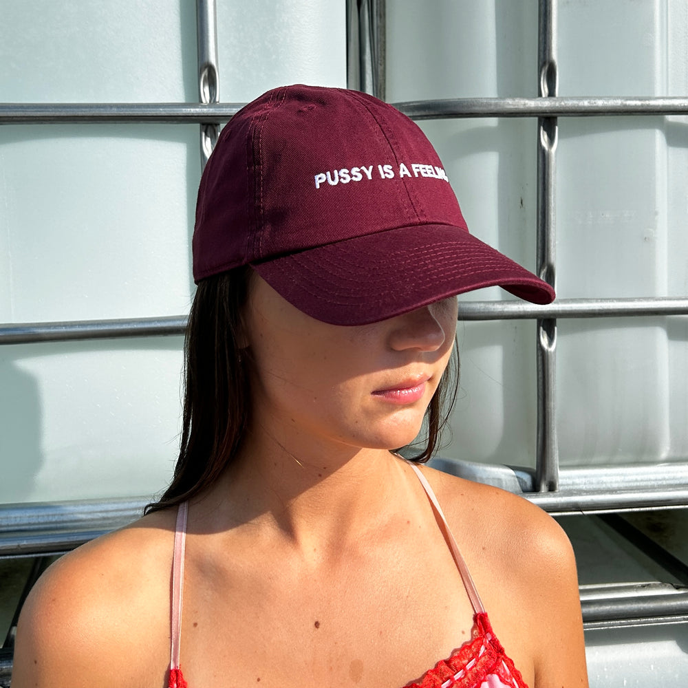 PUSSY IS A FEELING BURGUNDY DAD CAP