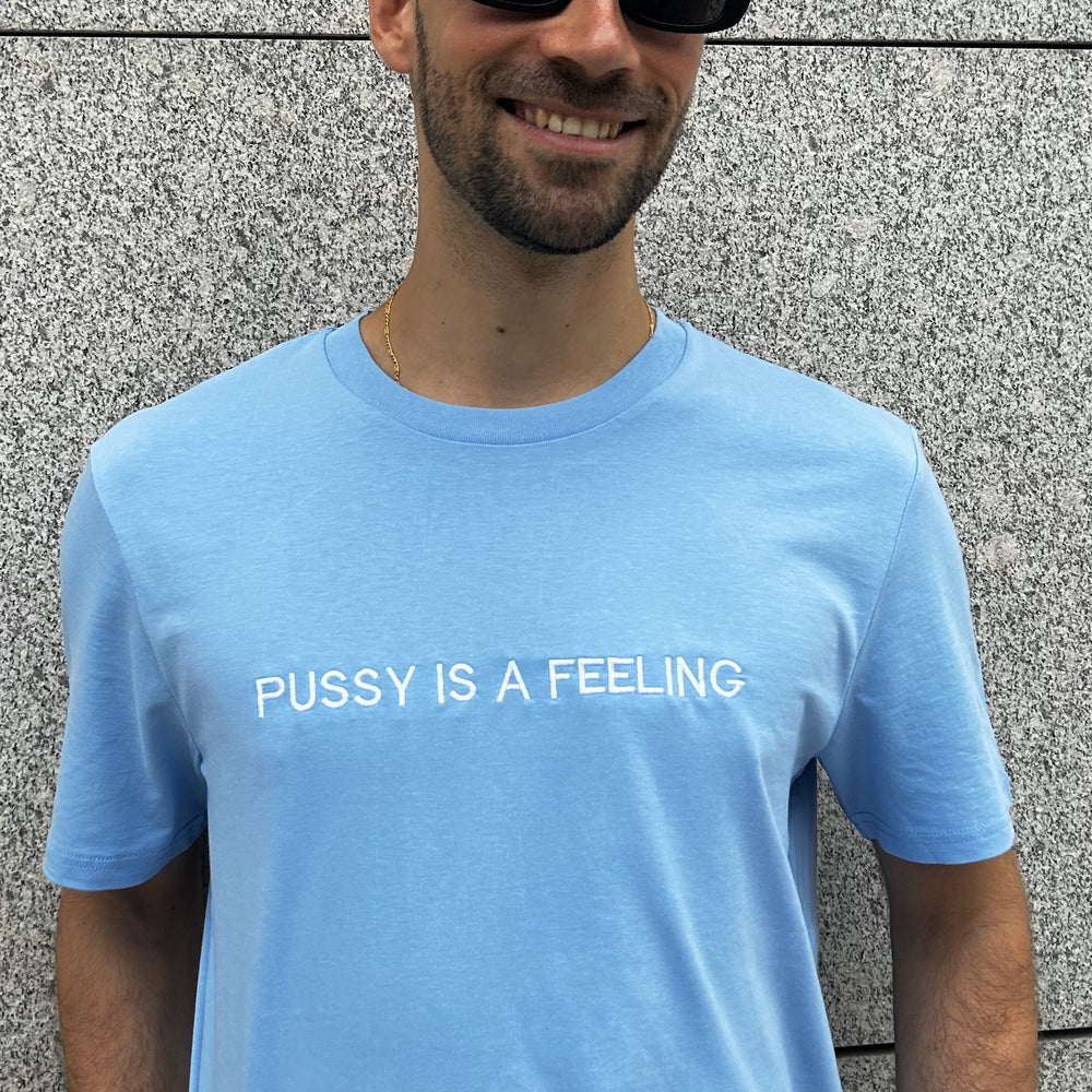 PUSSY IS A FEELING BABY BLUE T-SHIRT WITH EMBROIDERED SIGN