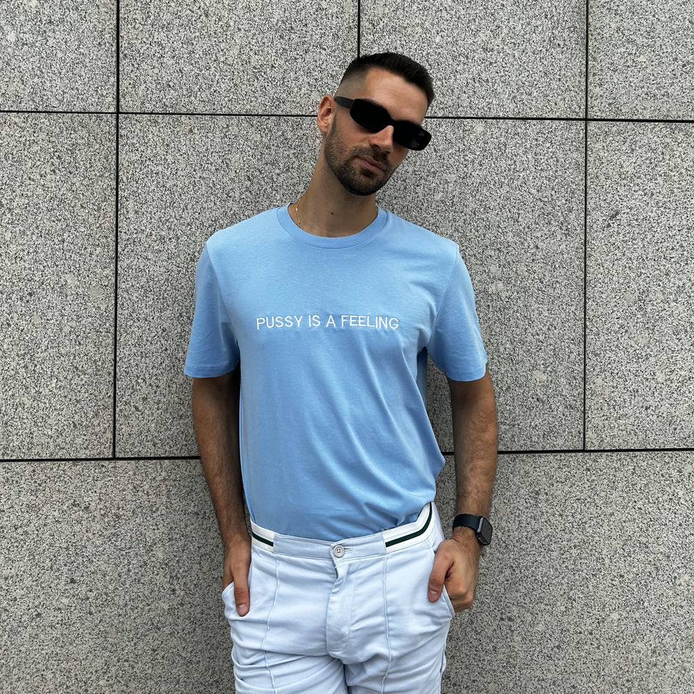 PUSSY IS A FEELING BABY BLUE T-SHIRT WITH EMBROIDERED SIGN